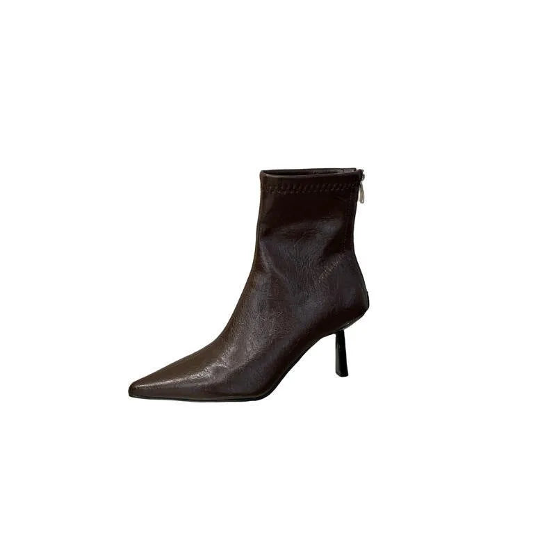 Stiletto heel ankle boots in black faux leather with pointed toe, tassel detail and back zipper, sizes 35-40