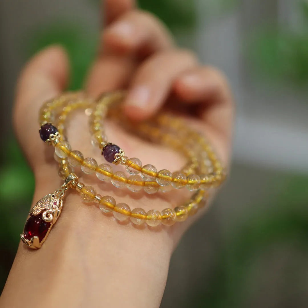 Natural Brazilian gold rutilated quartz bracelet with Chinese style design and hanging chopsticks