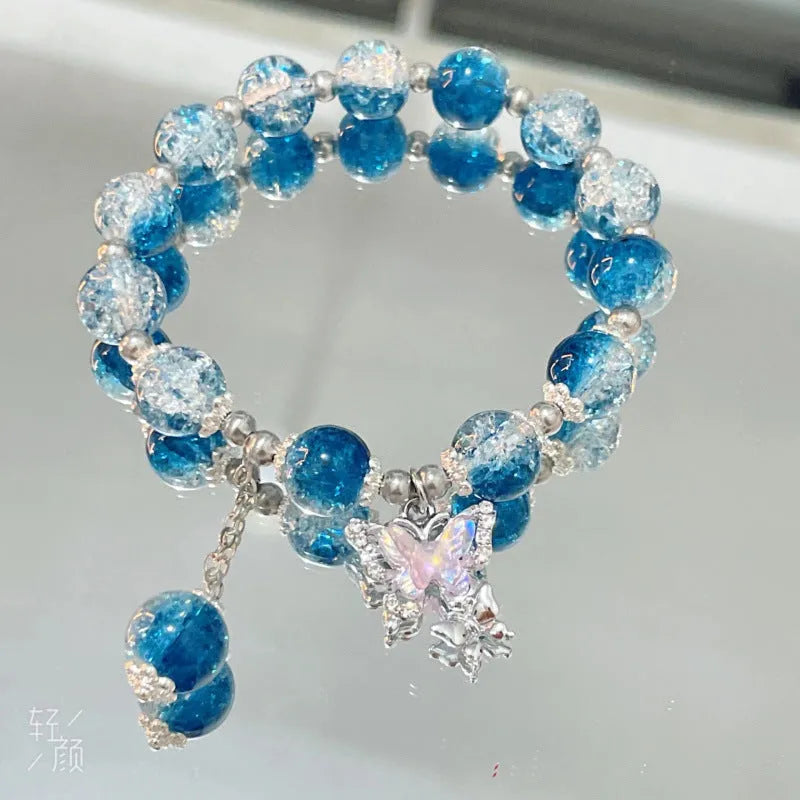 Chinese style glass bead bracelet with bamboo leaf design and manual craftsmanship details.
