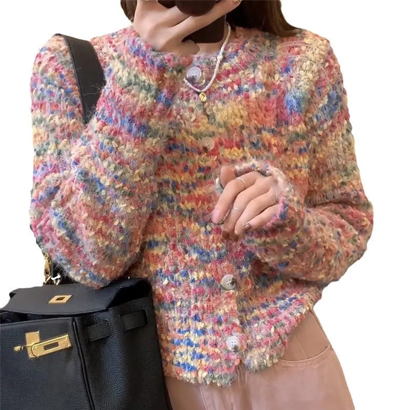 Pink or green retro-style rainbow patterned knitted cardigan on a model.