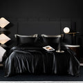 Solid colour silk bedding four-piece set on a bed, showing one of seven available colour options.