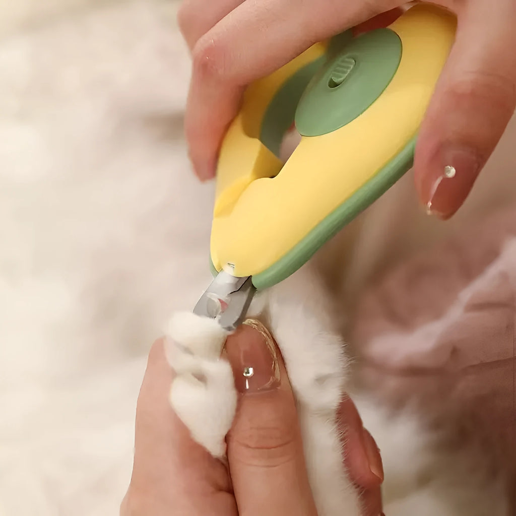 Professional pet nail clipper with LED light on, in green, pink, and white colour options for small dogs and cats.