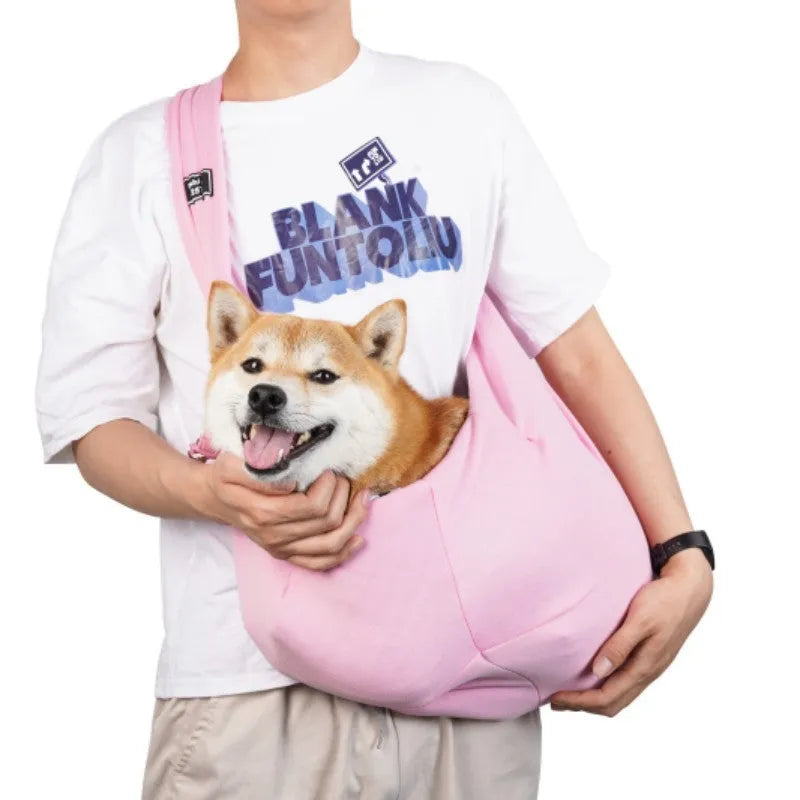 Large grey folding cat messenger backpack with mesh windows, shown on a person's back.