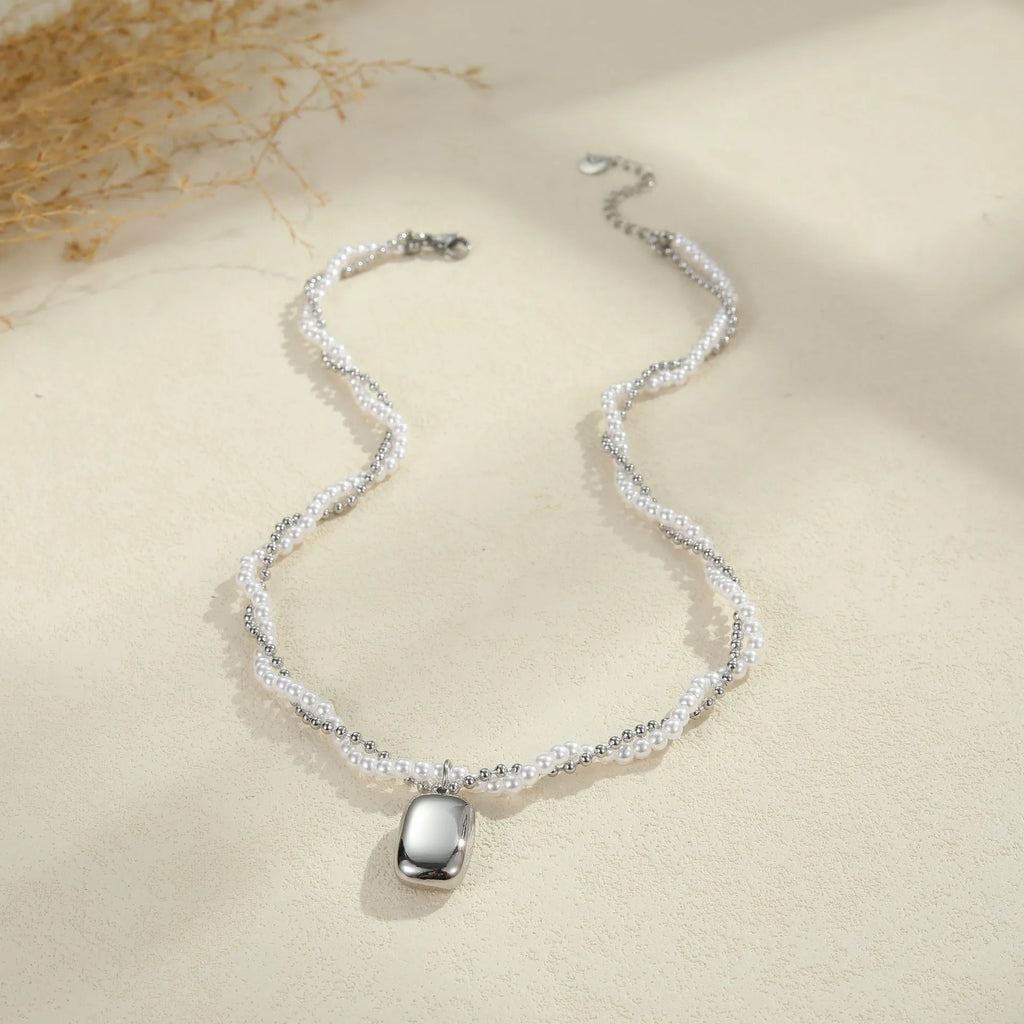 Double-layer pearl necklace with geometric pendant, stainless steel regular chain, gold or steel electroplated finish, 18K