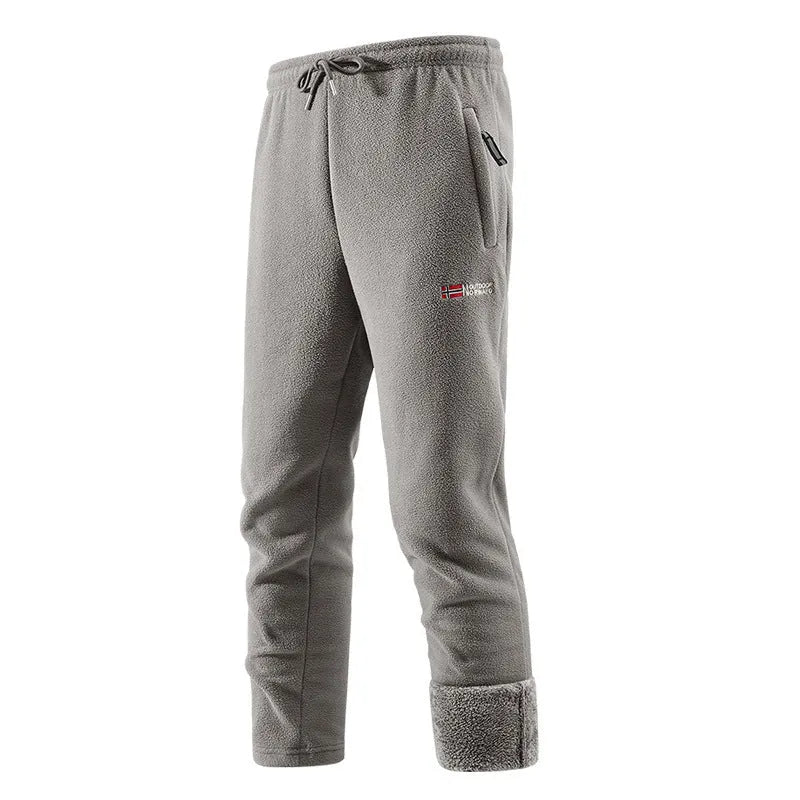 Fleece-lined thickened men's long pants in dark blue with flared low-waist style and patchwork design