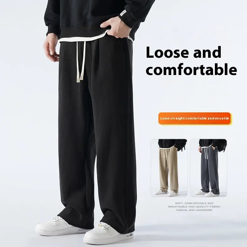 Man wearing apricot double-sided polar fleece lined loose fit casual sports trousers.