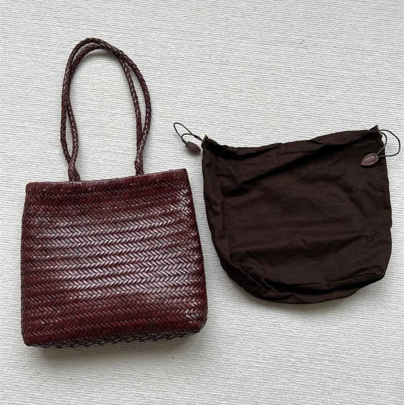 Brown handmade vintage woven leather tote bag with three-dimensional outer pockets.