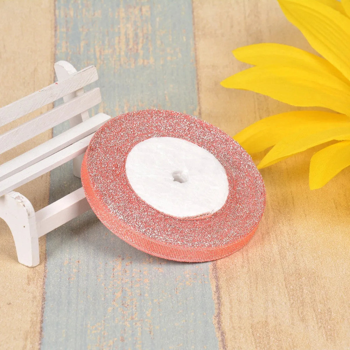 A roll of colourful green onion pattern polyester ribbon with metallic wire highlights, shown at 3-points width.