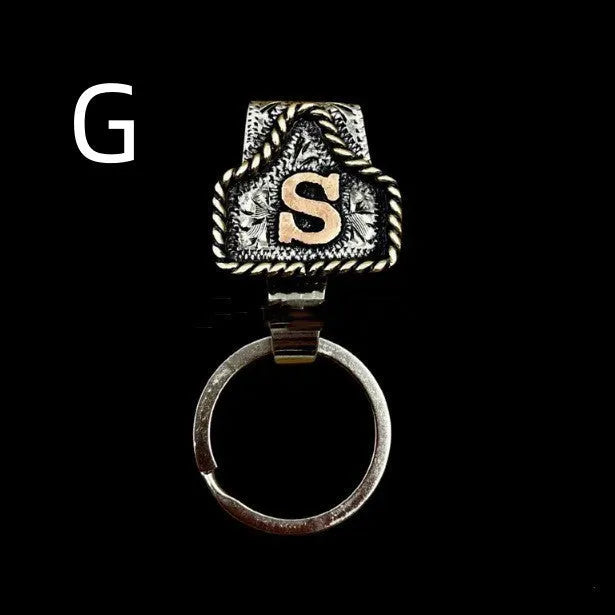 Handmade metal cow tag belt keychain in rustic design with multiple colour options