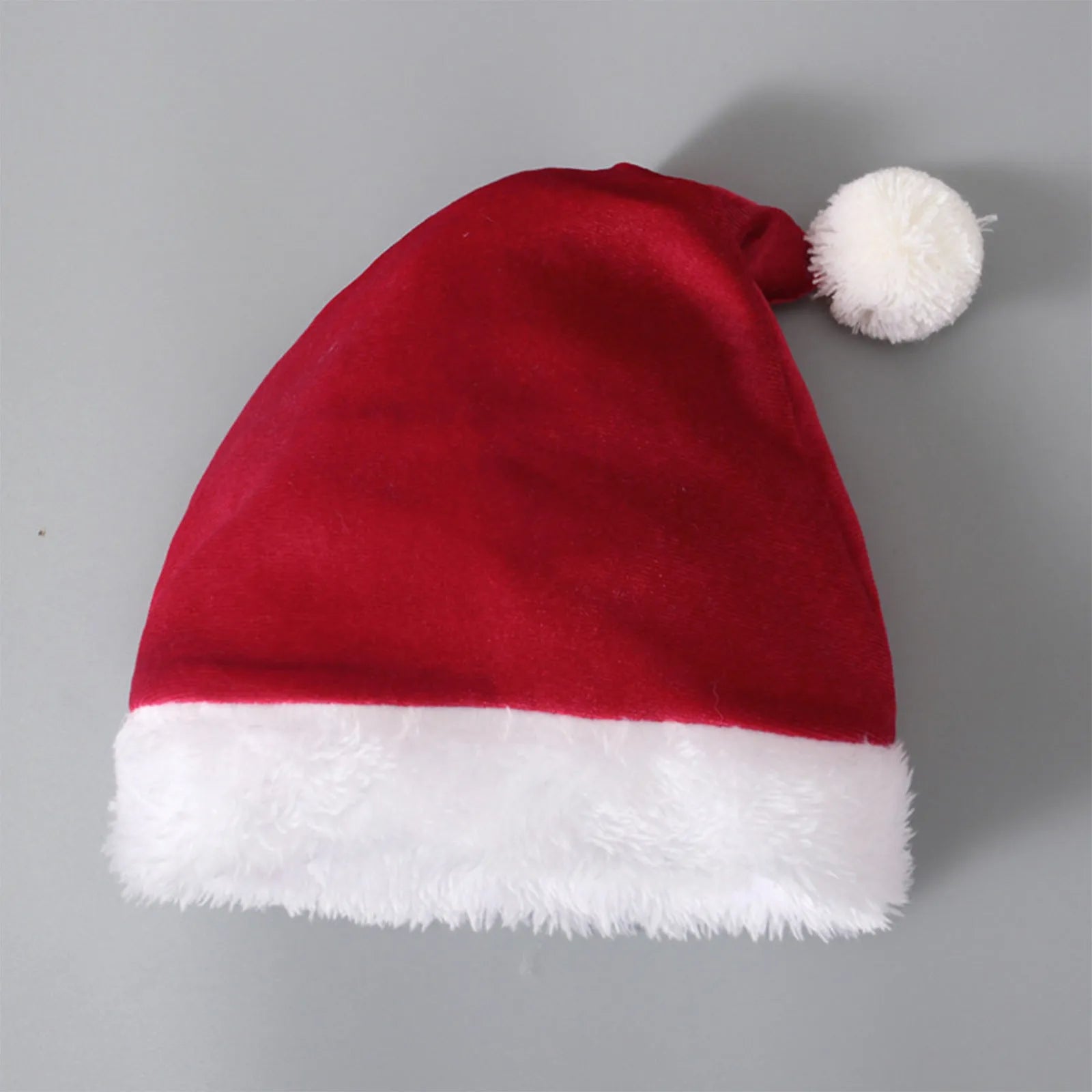 Red Korean velvet children's Christmas three-piece set with shirt, bell bottoms, and hat on display