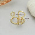 Adjustable opening copper ring with gold plate finish and asymmetrical U-shaped design