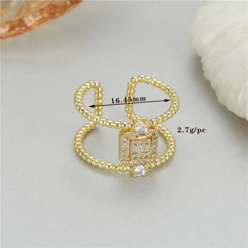Adjustable opening copper ring with gold plate finish and asymmetrical U-shaped design