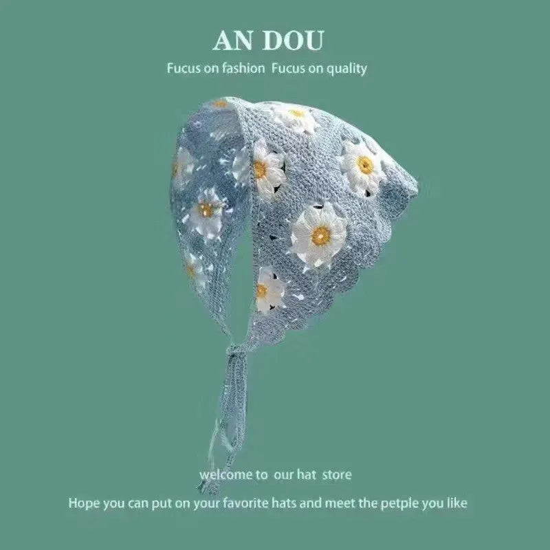Women's cotton triangle headscarf with floral print in a retro style, shown in a daisy pattern colour.