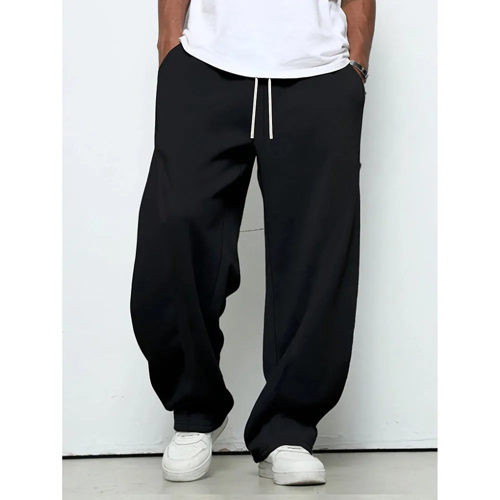 Men's straight leg casual trousers with a drawstring waist in black, dark grey, or light grey.