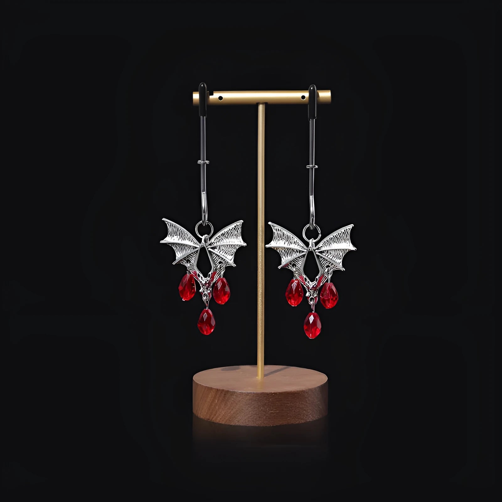 Silver diamond bat design nipple clamp with ruby accents and adjustable tension mechanism
