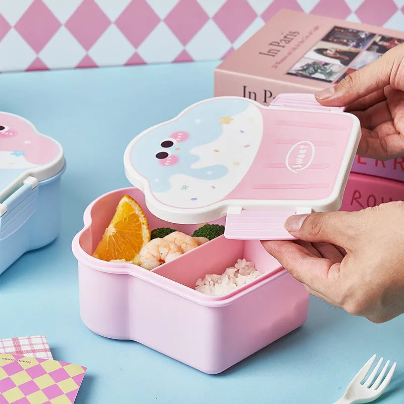 Blue and pink creative ice cream shaped plastic lunch box with spoon and fork set on a table.