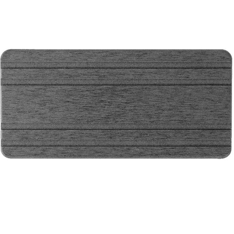 Three square diatom oil water draining pads in solid colours on a bathroom countertop.