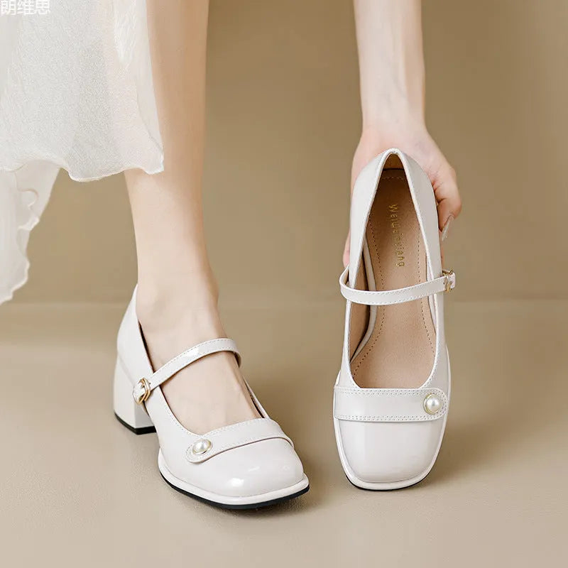 Womens mid-top patent leather ankle boots with a square toe and chunky block heel in apricot colour.
