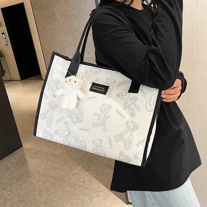 Women's canvas tote bag with diamond pattern design showing black and white colour options