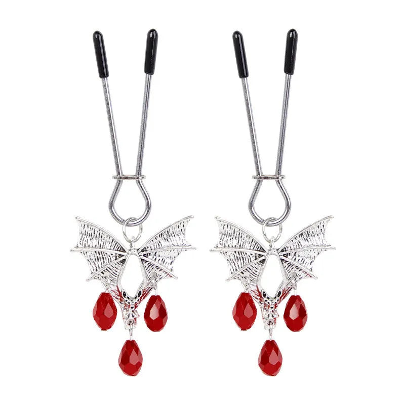 Silver diamond bat design nipple clamp with ruby accents and adjustable tension mechanism
