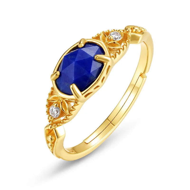 Geometric ellipse silver-colour alloy ring with a central natural lapis lazuli stone.