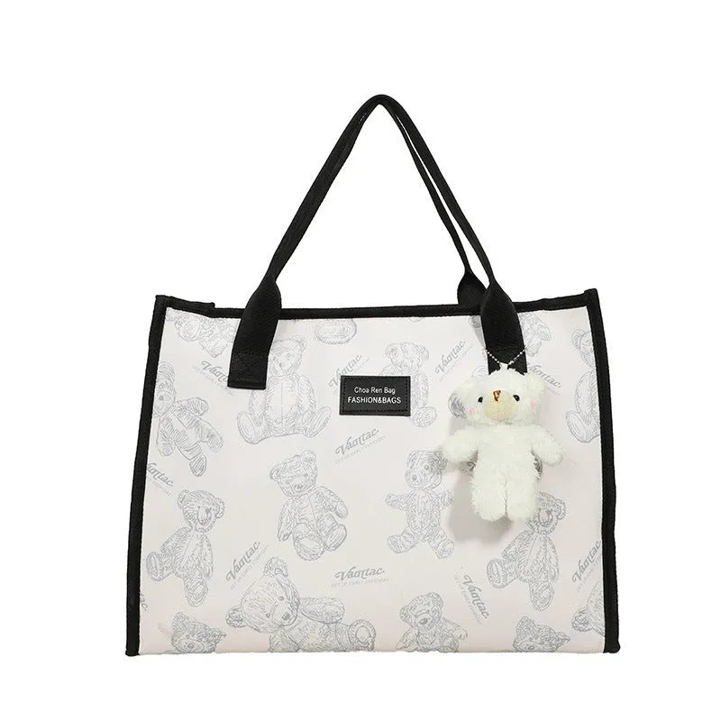 Women's canvas tote bag with diamond pattern design showing black and white colour options