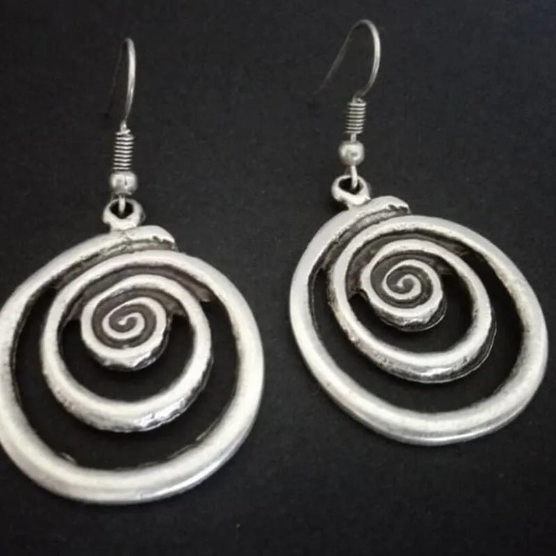 Geometric spiral earrings with distressed silver finish and national style details