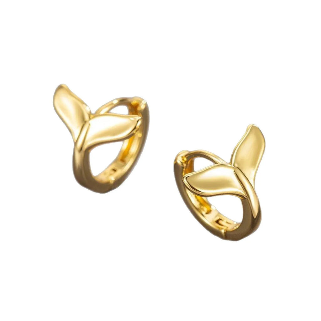 A pair of simple women's fishtail earrings in electroplated copper, shown in white gold colour.