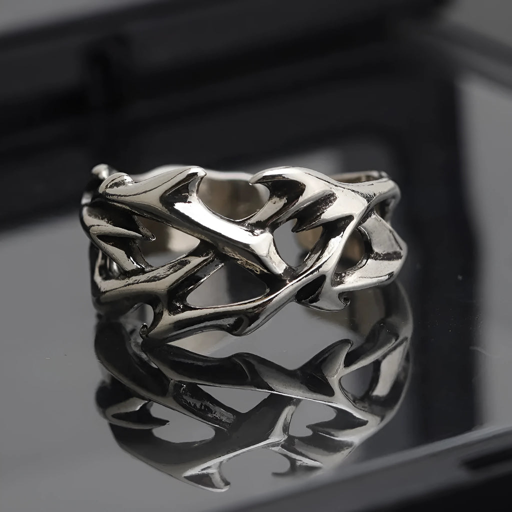 Adjustable copper men's ring with geometric thorn and flower design.