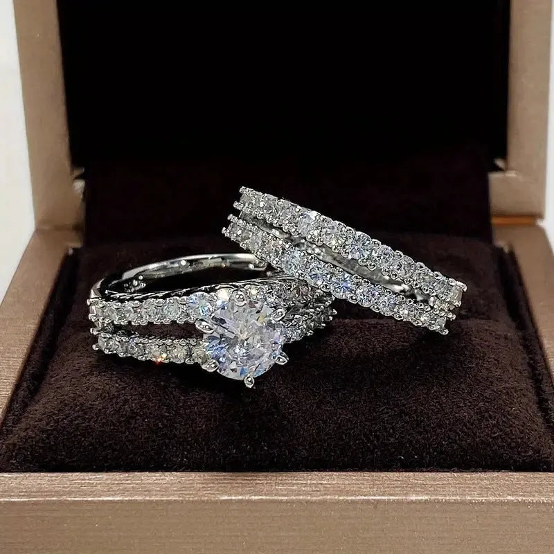Two-ring women's set showing jewelled and geometric designs in silver, gold, and rose gold alloy