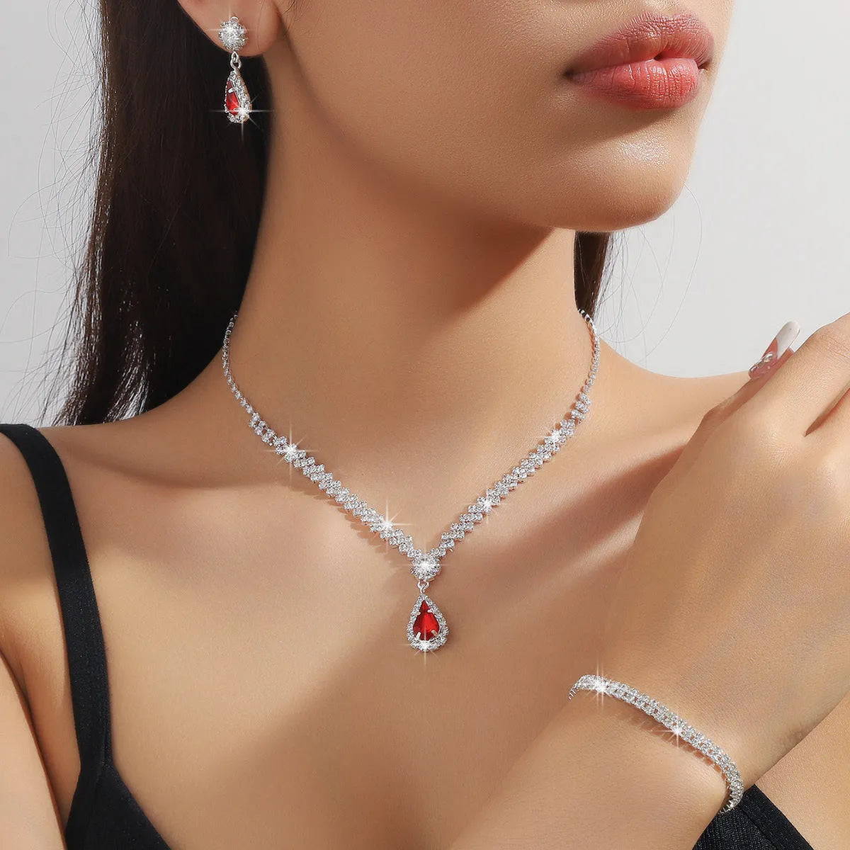 Claw chain necklace and earrings set with water drop rhinestones in multiple colour options