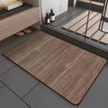 Square diatom ooze bathroom floor mat with wood grain geometric pattern on a tiled floor.