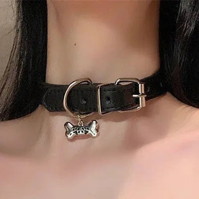 Black adjustable dog collar showing cat paw, bone and LD leather style options with measuring tape showing 21-50cm range