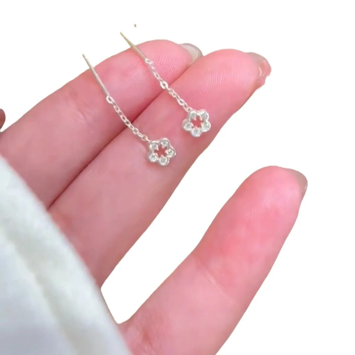 Sterling silver hollow flower dangling earrings with natural petal design and butterfly backs