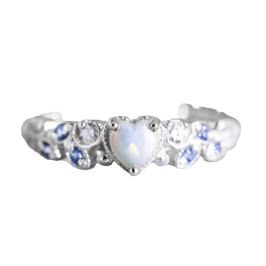 Women's peach-coloured heart ring with floral and opal design, silver-white electroplated finish.