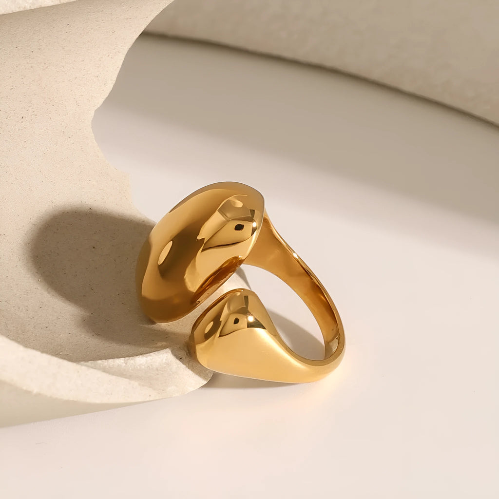 Women's exaggerated geometric open ring in stainless steel with electroplated finish.