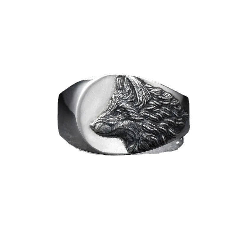 Geometric silver wolf head men's ring made of alloy metal on a grey background.