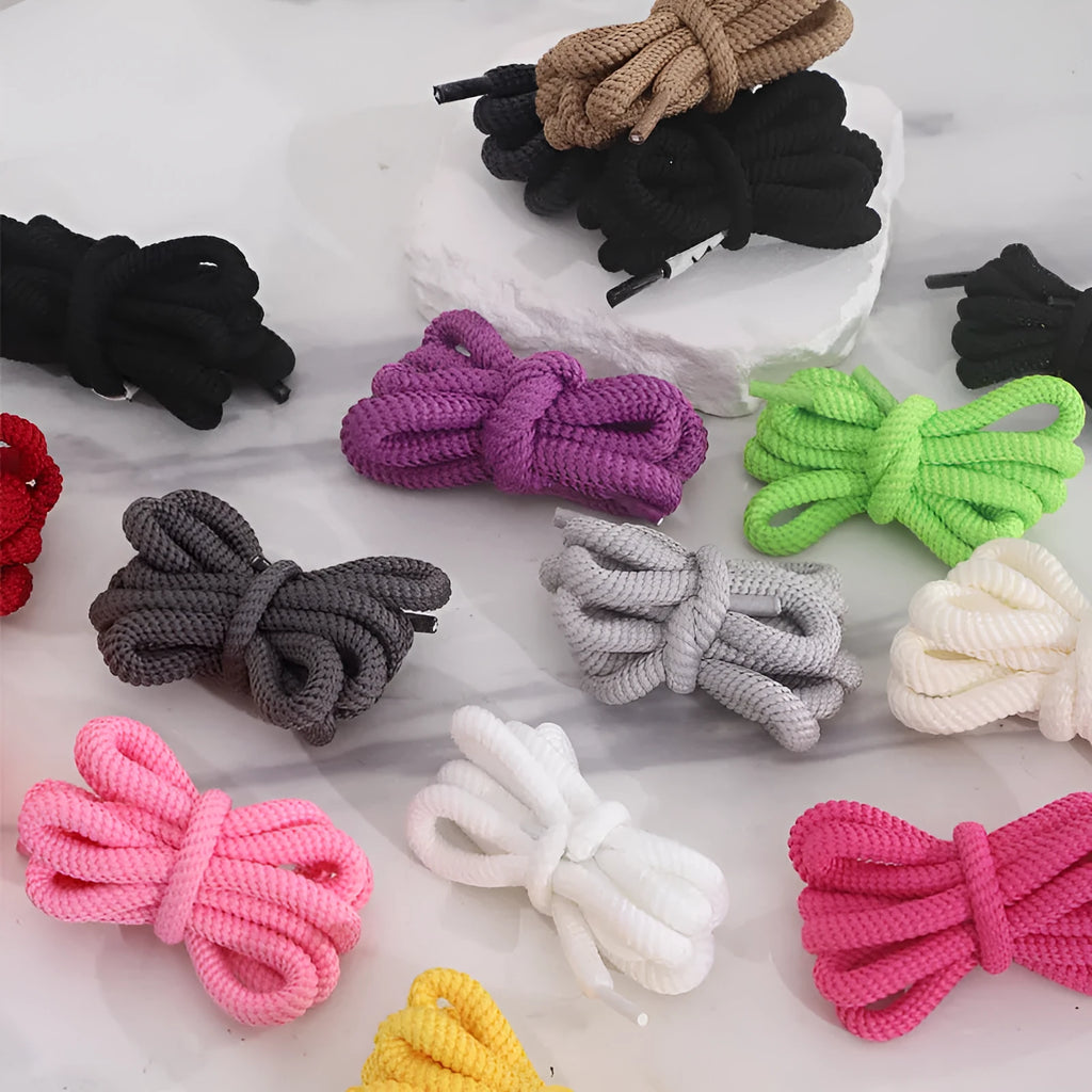 Flat oval woven shoelaces in various colours showing 1.0cm width and length options.