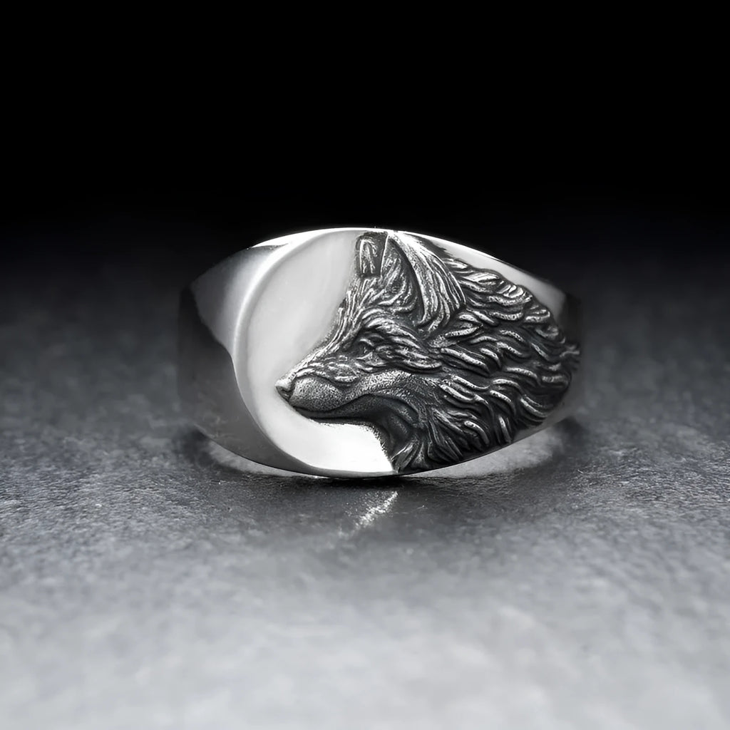 Geometric silver wolf head men's ring made of alloy metal on a grey background.