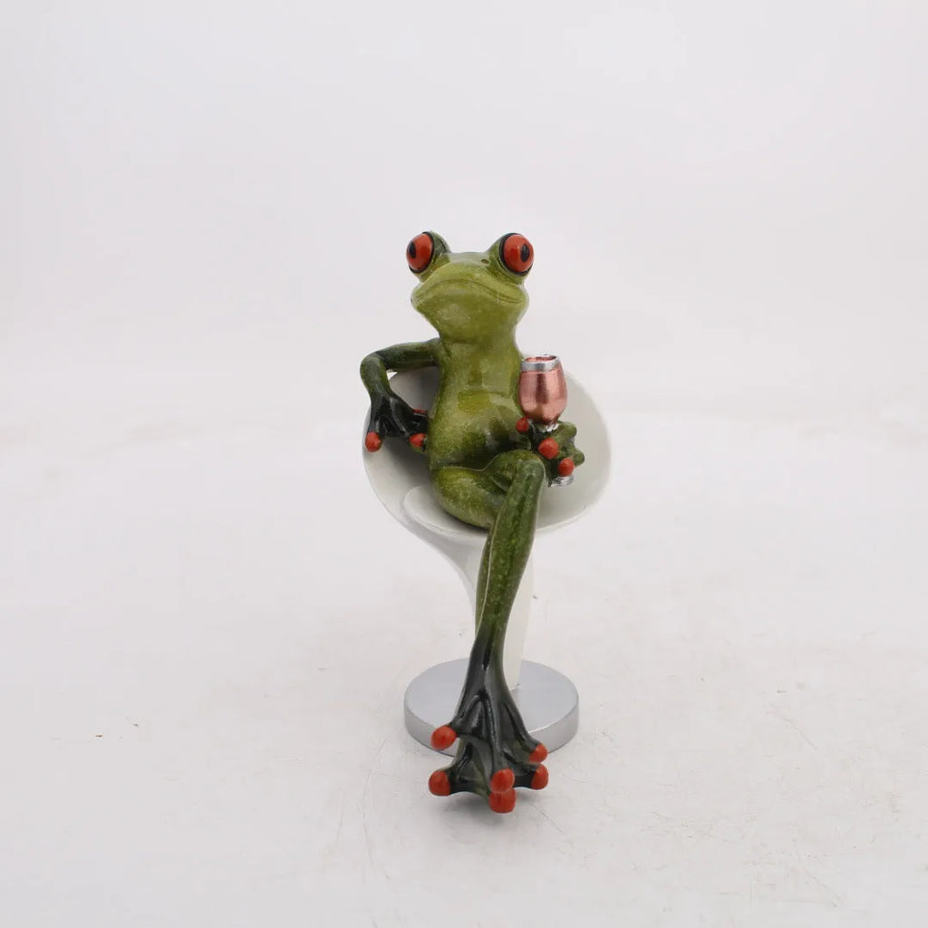 Pastoral style synthetic resin frog ornament for home decoration on a wooden shelf.