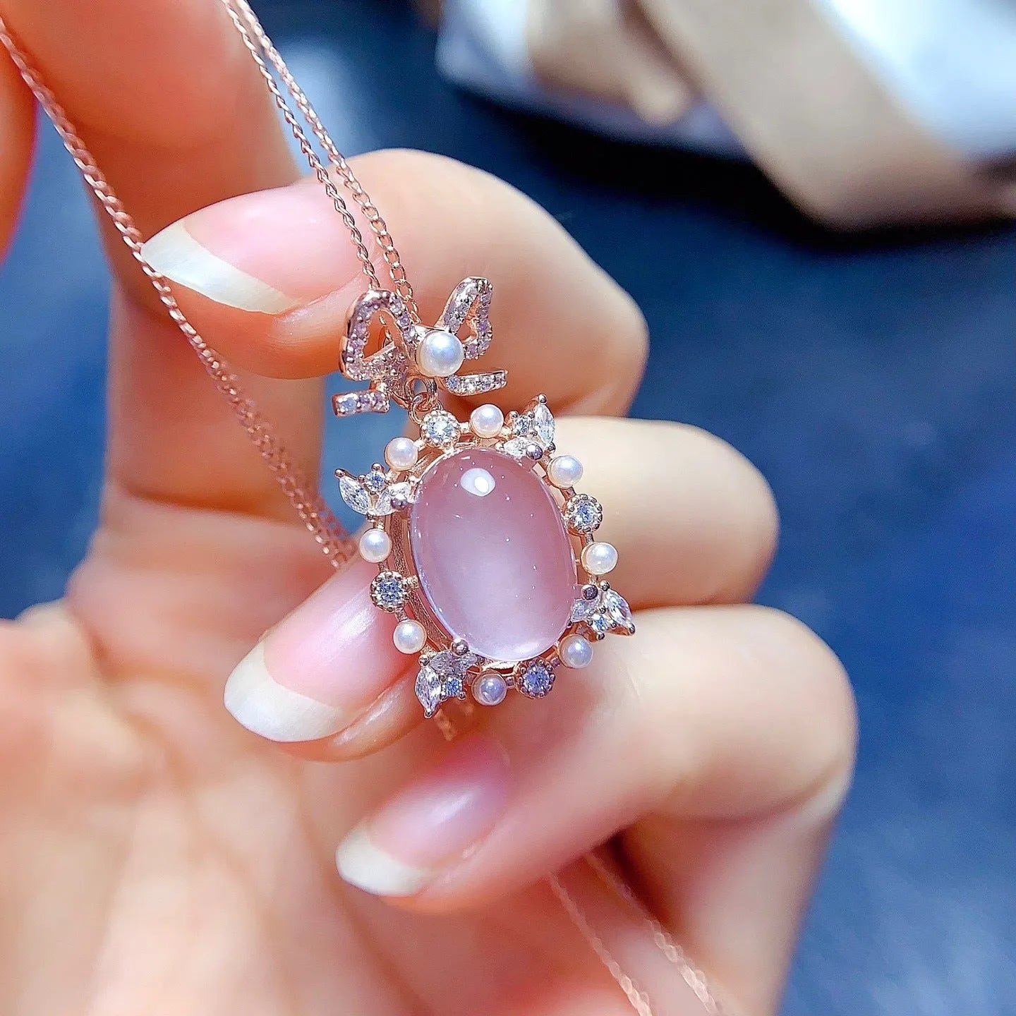 Geometric rose quartz pendant on a rose gold plated silver chain.