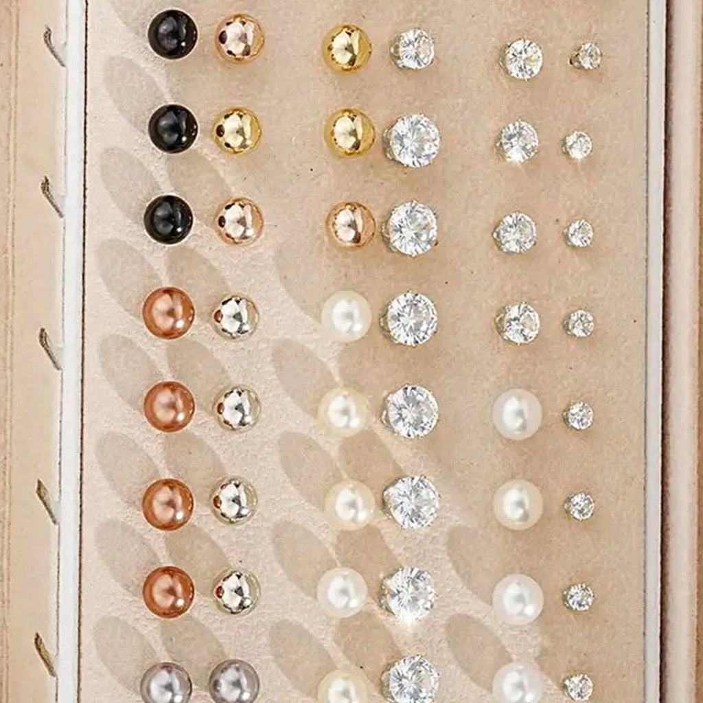 108 gold and yellow geometric and round alloy drop earrings laid out.