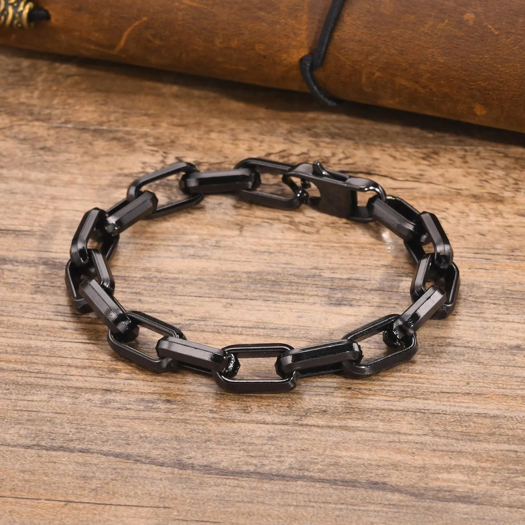 Men's titanium steel square chain bracelet in simple design on wrist.