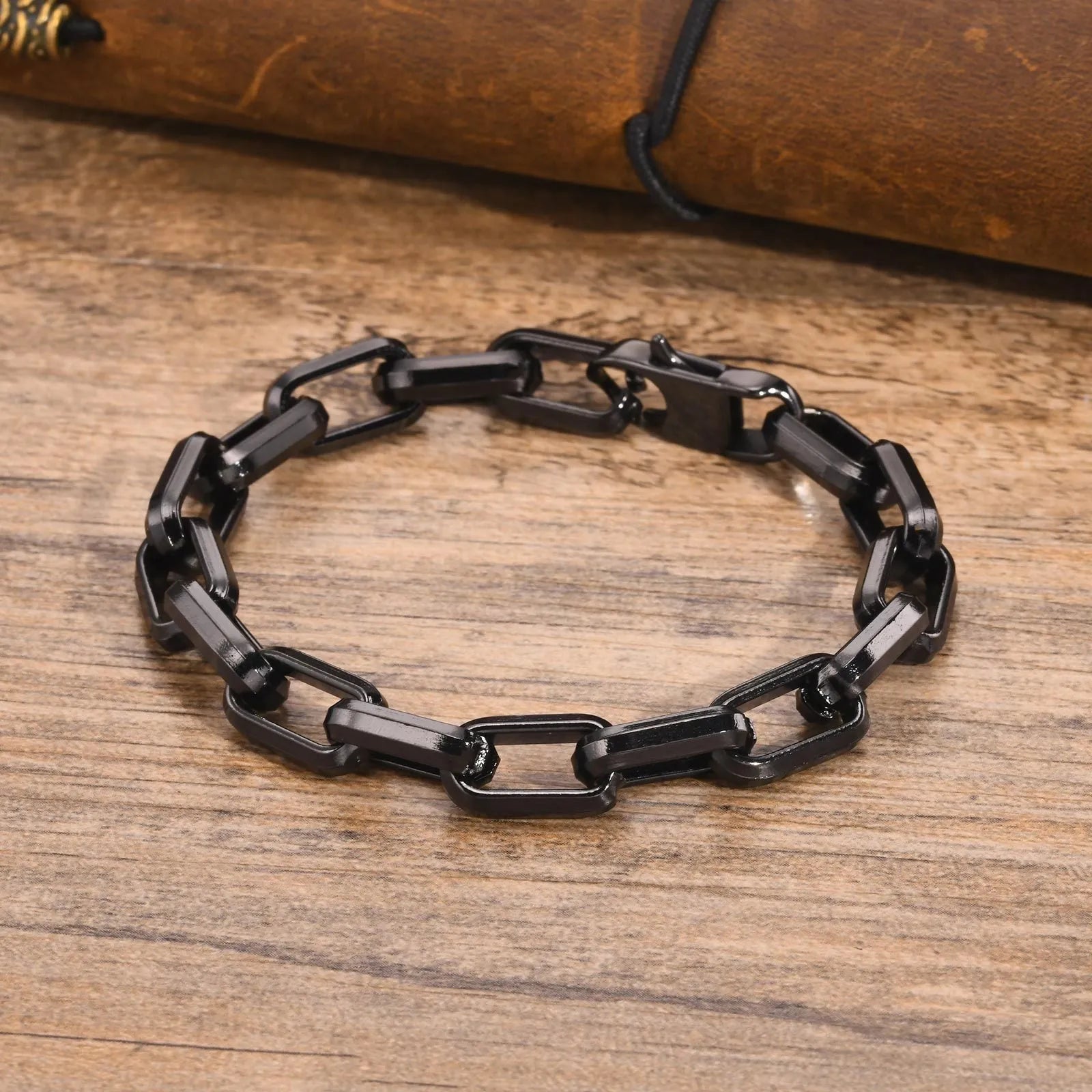 Men's titanium steel square chain bracelet in simple design on wrist.