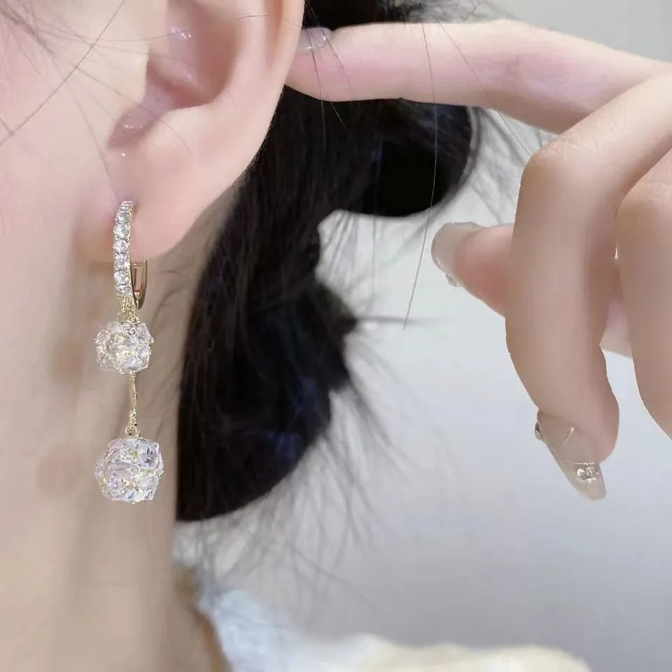 Silver tone rhinestone tassel ball drop earrings with double pendant design
