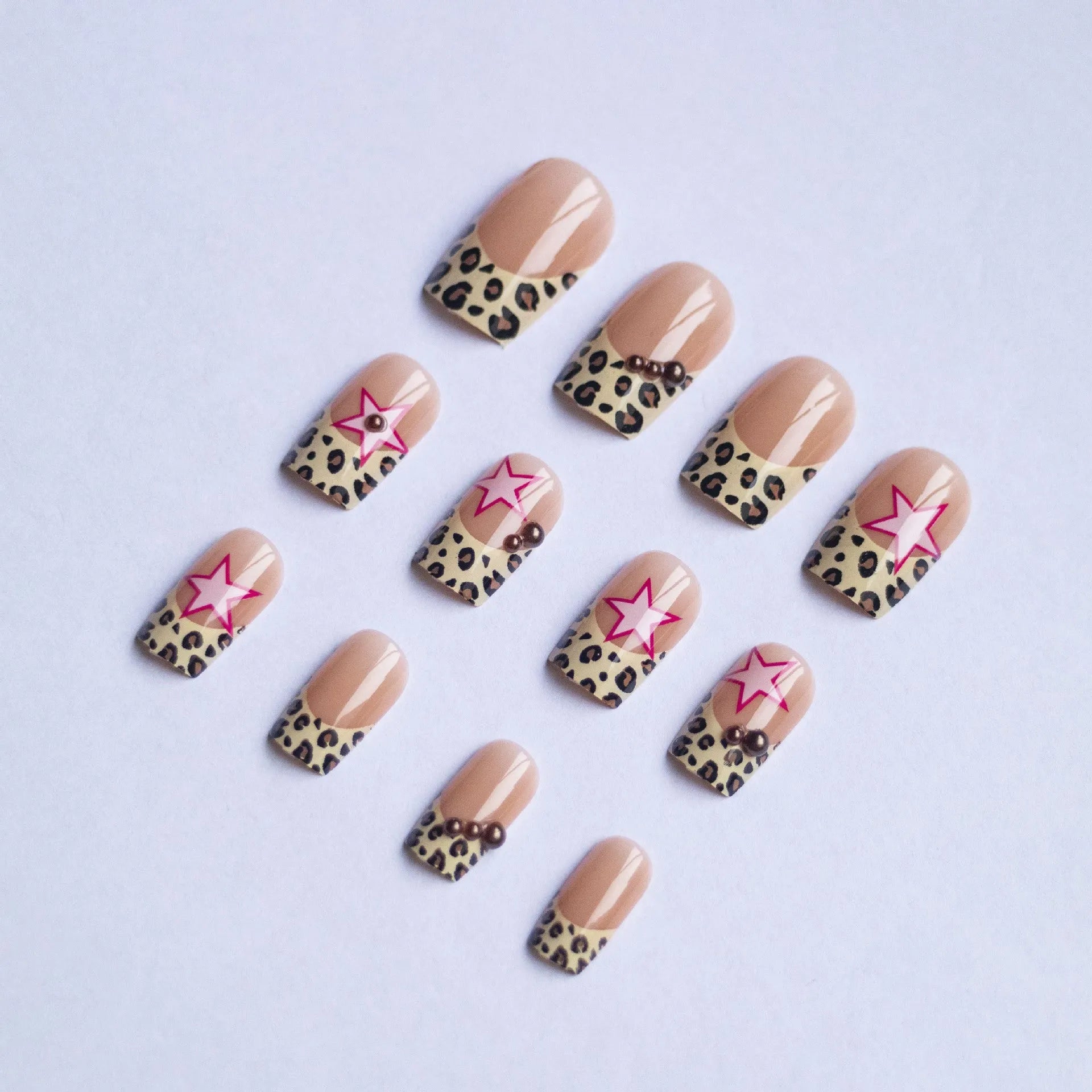 Leopard print French manicure nail art stickers with rhinestone pearls and metallic five-pointed star accessories