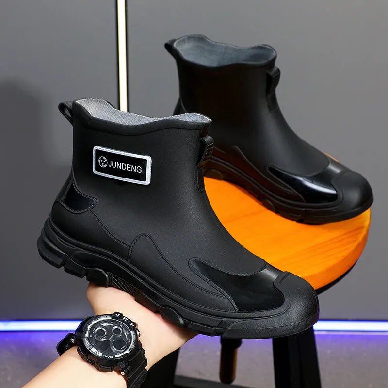 Short tube PVC waterproof boots in black, black and yellow, or khaki with flat heel and round toe.