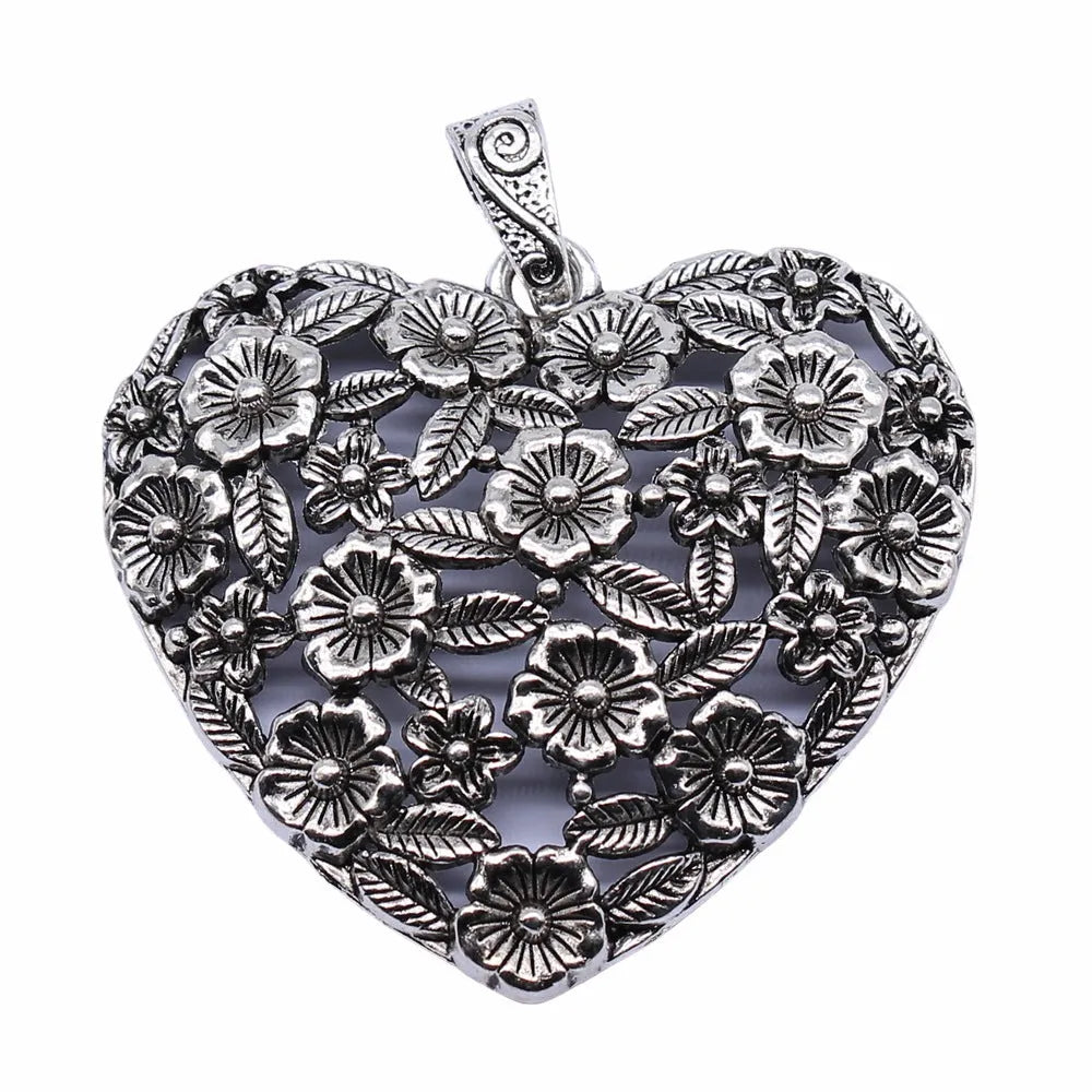 Ancient silver hollow flower love pendant measuring 67mm by 58mm with electroplated finish