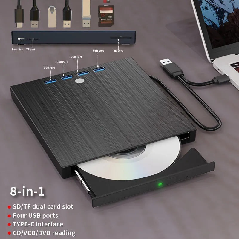 Black external DVD burner with USB and TYPE-C cables, tray loading drive on a desk
