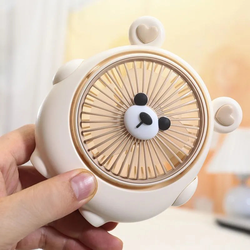 Dog-themed USB desktop electric fan in one of six colour options on a desk.